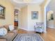 Living room featuring neutral paint, comfortable furniture, and arched doorway at 1421 Arbitus Cir, Oviedo, FL 32765