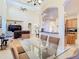 Open concept featuring the dining room, kitchen and living room with high ceilings at 1421 Arbitus Cir, Oviedo, FL 32765