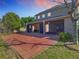 An outdoor patio area has brick pavers with a screened in porch area for enjoying outdoor Florida living at 1421 Arbitus Cir, Oviedo, FL 32765