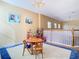 Spacious playroom on the second floor features a chandelier and decor at 1421 Arbitus Cir, Oviedo, FL 32765