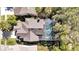Aerial view of a home with a screened-in pool and well-maintained roof in a lush neighborhood at 14266 Squirrel Run, Orlando, FL 32828