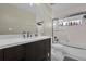 Bright bathroom featuring a vanity with a white countertop and a shower-tub combination at 14266 Squirrel Run, Orlando, FL 32828