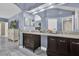 Spacious bathroom features a dual vanity with granite countertops and a large mirror at 14266 Squirrel Run, Orlando, FL 32828