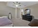 Neutral bedroom features carpet, a ceiling fan, a mirror and dresser at 14266 Squirrel Run, Orlando, FL 32828