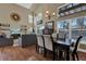 Dining room with table, chairs, and view to living area, showcases open-concept living at 14266 Squirrel Run, Orlando, FL 32828