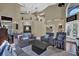 Open-concept living area showcases high ceilings, a staircase, and modern furnishings at 14266 Squirrel Run, Orlando, FL 32828