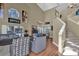 Bright living area with a staircase, modern furniture, high ceilings, and large windows at 14266 Squirrel Run, Orlando, FL 32828
