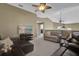 Upstairs living area features comfortable seating, a ceiling fan, and wall-mounted television at 14266 Squirrel Run, Orlando, FL 32828