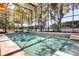 Beautiful screened-in pool with fountains and lush landscaping providing a private outdoor oasis at 14266 Squirrel Run, Orlando, FL 32828