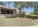 An expansive backyard featuring a large grassy area, mature trees and plenty of room for outdoor activities at 1570 Farrindon Cir, Lake Mary, FL 32746