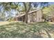 A spacious backyard with lush green grass and mature trees offering ample shade at 1570 Farrindon Cir, Lake Mary, FL 32746