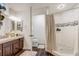 Updated bathroom showcasing a vanity with granite countertop and a walk-in shower at 1570 Farrindon Cir, Lake Mary, FL 32746