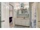 Well-lit bathroom with a granite countertop vanity and coordinated blue accents at 1570 Farrindon Cir, Lake Mary, FL 32746