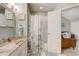 Bright bathroom features a shower/tub with elegant floral curtain and vanity at 1570 Farrindon Cir, Lake Mary, FL 32746