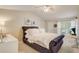 Cozy bedroom featuring a plush, upholstered bed and neutral decor at 1570 Farrindon Cir, Lake Mary, FL 32746