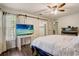 Bedroom showcasing barn door, TV, and ensuite bathroom with updated shower at 1570 Farrindon Cir, Lake Mary, FL 32746