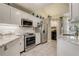 Well-lit kitchen featuring stainless steel appliances and granite countertops at 1570 Farrindon Cir, Lake Mary, FL 32746