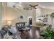 Spacious living area showcasing hardwood floors, stylish furniture, and an open floor plan at 1570 Farrindon Cir, Lake Mary, FL 32746
