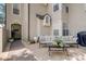 This cozy patio is decorated with outdoor furniture, plants, and other decorations at 1570 Farrindon Cir, Lake Mary, FL 32746