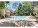 A refreshing community pool with lounge chairs and umbrellas surrounded by lush greenery at 1570 Farrindon Cir, Lake Mary, FL 32746