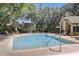 Community pool offering a relaxing oasis with plenty of seating and beautifully landscaped surroundings at 1570 Farrindon Cir, Lake Mary, FL 32746