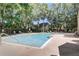 A large community pool surrounded by lush greenery, providing a serene escape for residents at 1570 Farrindon Cir, Lake Mary, FL 32746