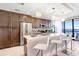 Modern kitchen with stainless steel appliances, granite countertops, and stylish breakfast bar at 16300 County Road 455 # 401, Montverde, FL 34756