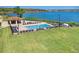 Inviting swimming pool area with ample seating and stunning lake views for relaxing and enjoying the scenery at 16300 County Road 455 # 401, Montverde, FL 34756