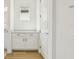 Bathroom vanity with white cabinets, marble countertop, and gold hardware at 16354 Silver Grove Blvd, Winter Garden, FL 34787