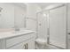 Modern bathroom with white cabinets, quartz countertop, shower, and a glass door at 16354 Silver Grove Blvd, Winter Garden, FL 34787