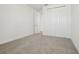 Bright bedroom offering neutral carpet, white walls, and a double door closet at 16354 Silver Grove Blvd, Winter Garden, FL 34787