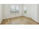 Bedroom features wood-look floors, white walls and trim, and natural light at 16354 Silver Grove Blvd, Winter Garden, FL 34787