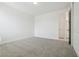Bright and airy bedroom featuring neutral carpeting and a closet at 16354 Silver Grove Blvd, Winter Garden, FL 34787