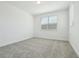Bright bedroom with a window, neutral carpeting, and a closet at 16354 Silver Grove Blvd, Winter Garden, FL 34787