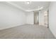Spacious bedroom features neutral carpet, tray ceiling, and multiple doors at 16354 Silver Grove Blvd, Winter Garden, FL 34787