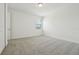 Well-lit bedroom with a neutral color scheme and a large window at 16354 Silver Grove Blvd, Winter Garden, FL 34787
