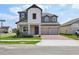 Charming two-story home featuring a two-car garage, manicured lawn and welcoming entrance at 16354 Silver Grove Blvd, Winter Garden, FL 34787