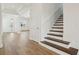 Bright foyer featuring hardwood floors, a staircase, and a view of the living area at 16354 Silver Grove Blvd, Winter Garden, FL 34787