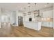 Modern kitchen with stainless appliances, a kitchen island, and beautiful pendant lighting at 16354 Silver Grove Blvd, Winter Garden, FL 34787