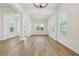 Open-concept living room featuring recessed lighting, hardwood floors, and a view of the neighborhood at 16354 Silver Grove Blvd, Winter Garden, FL 34787