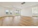 Spacious living room features wood flooring, recessed lighting, and large windows that let in natural light at 16354 Silver Grove Blvd, Winter Garden, FL 34787