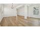 Bright and spacious room with light wood floors and modern finishes, offering versatility and style at 16354 Silver Grove Blvd, Winter Garden, FL 34787
