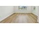 Bright room showcases beautiful wood-look flooring, white trim, and natural light from the double window at 16354 Silver Grove Blvd, Winter Garden, FL 34787