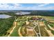 Beautiful aerial view showcasing a community pool, golf course, and lake at 17300 Pesce Loop, Montverde, FL 34756