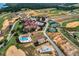 Breathtaking aerial view featuring a community pool, tennis courts, and golf course at 17300 Pesce Loop, Montverde, FL 34756