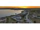 Lakeside estate boasts luxury living with scenic views, lush landscaping, and convenient road access at 17300 Pesce Loop, Montverde, FL 34756