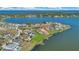 An aerial view of a neighborhood on a lake at 17300 Pesce Loop, Montverde, FL 34756