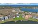 An aerial view of several homes and a lake at 17300 Pesce Loop, Montverde, FL 34756