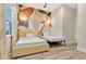 Shared bedroom with two twin beds and decorative wall art at 17300 Pesce Loop, Montverde, FL 34756