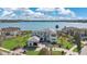 Stunning lakefront estate with lush landscaping and modern architectural details at 17300 Pesce Loop, Montverde, FL 34756